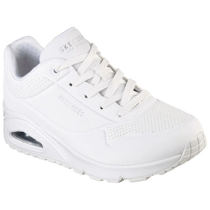 A white sneaker with a cushioned sole and perforated design sits upright showcasing laces and branding on the side set against a plain white background.