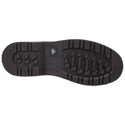 A black rubber boot sole is displayed with deep treads and ridges designed for grip while the context suggests it is intended for outdoor or work environments.