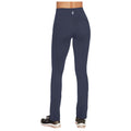 Navy blue leggings are shown from the back with a high waist and two back pockets while being worn with black athletic shoes on a neutral background.
