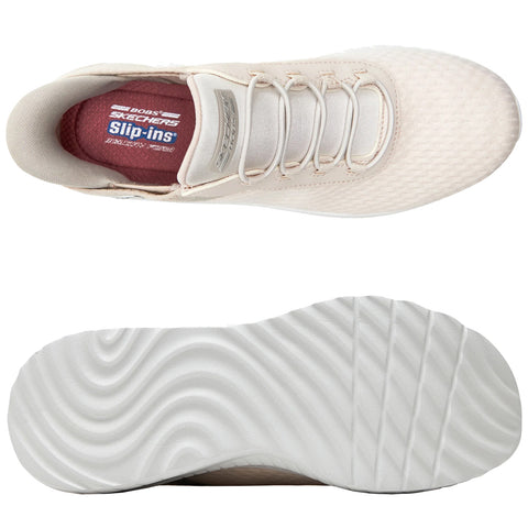 A light-colored sneaker is displayed with a textured upper and elastic laces showcasing a cushioned interior. The sole features a wave-like pattern designed for traction on various surfaces.
