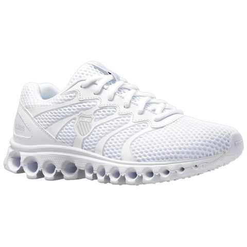 A white athletic shoe is positioned prominently with a mesh upper offering breathability featuring a unique sole with circular cushioning elements that enhance shock absorption suitable for running or casual wear.