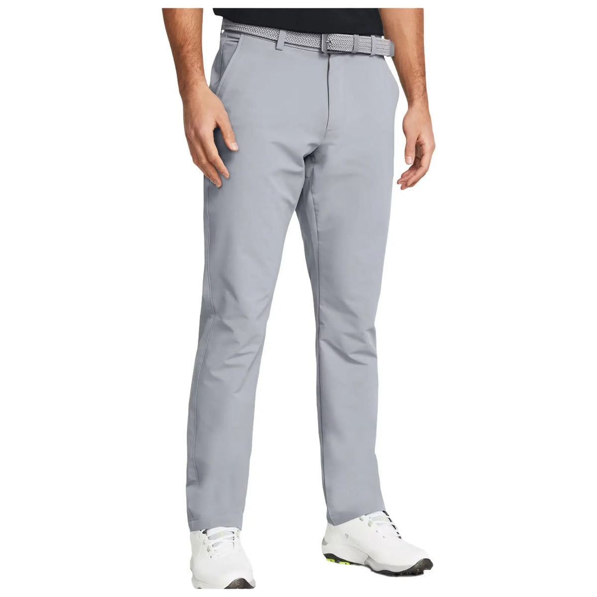 Gray pants worn by a man standing with his hand at his side in a casual setting complemented by a woven belt and white shoes, suggesting a comfortable and stylish outfit.