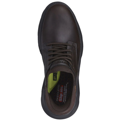 A brown shoe is displayed with laces and a textured surface showcasing a sleek design the insole features distinct green and black colors with text indicating brand and comfort technology