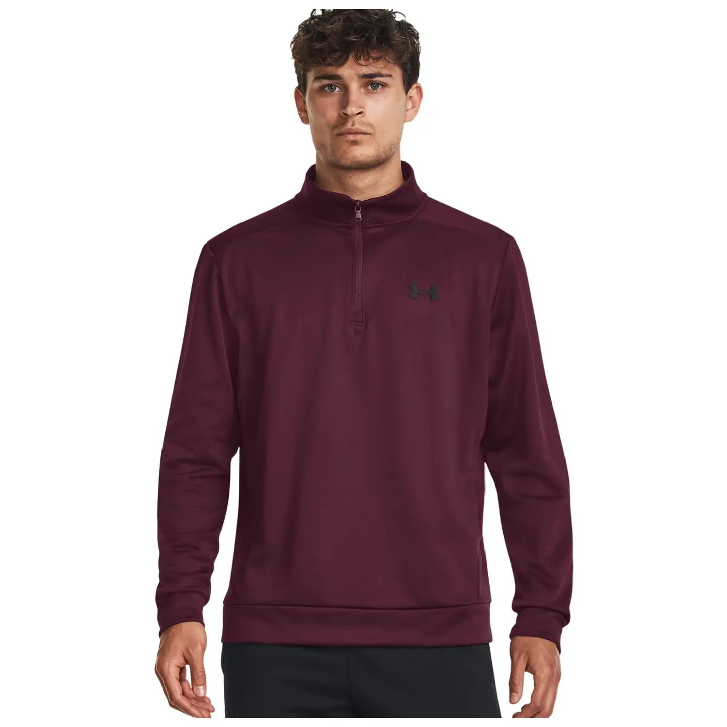 A young man is wearing a maroon quarter-zip pullover with a high collar standing against a plain white background showcasing the garment and its brand logo on the chest.