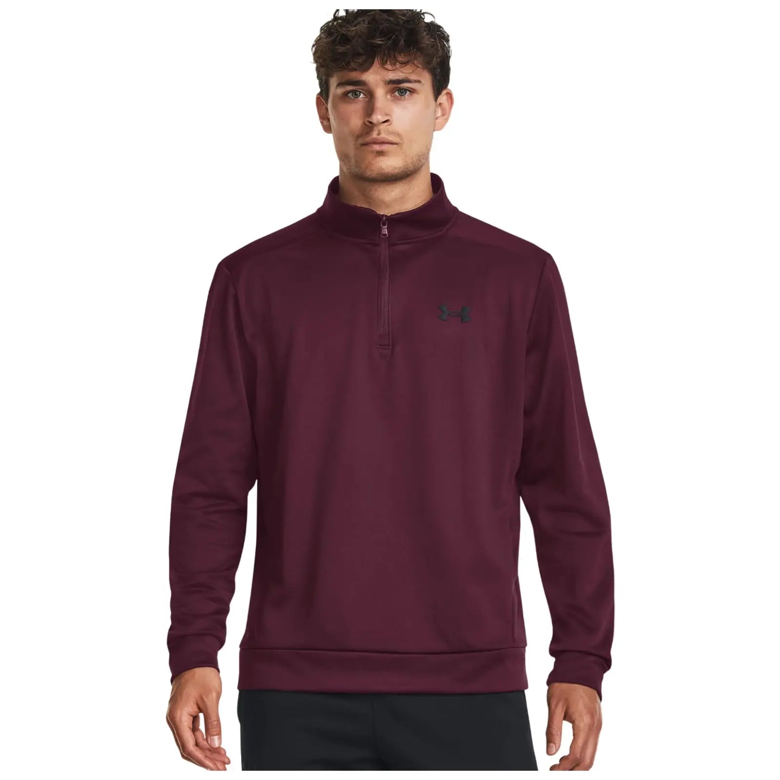 A young man is wearing a maroon quarter-zip pullover with a high collar standing against a plain white background showcasing the garment and its brand logo on the chest.