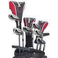 A golf bag contains several clubs with shiny metal heads and black and red grips resting upright. The clubs are organized with headcovers on the driver and woods at the top.