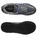 A grey and purple hiking shoe is displayed from above and below with visible laces and a textured black rubber sole suitable for outdoor terrain. The brand HI-TEC is visible inside the shoe.