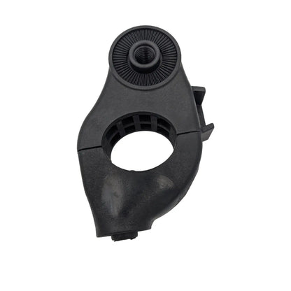 A black plastic clamp with an adjustable circular opening and threaded top is positioned upright, designed to secure objects together in a workshop or mechanical context.