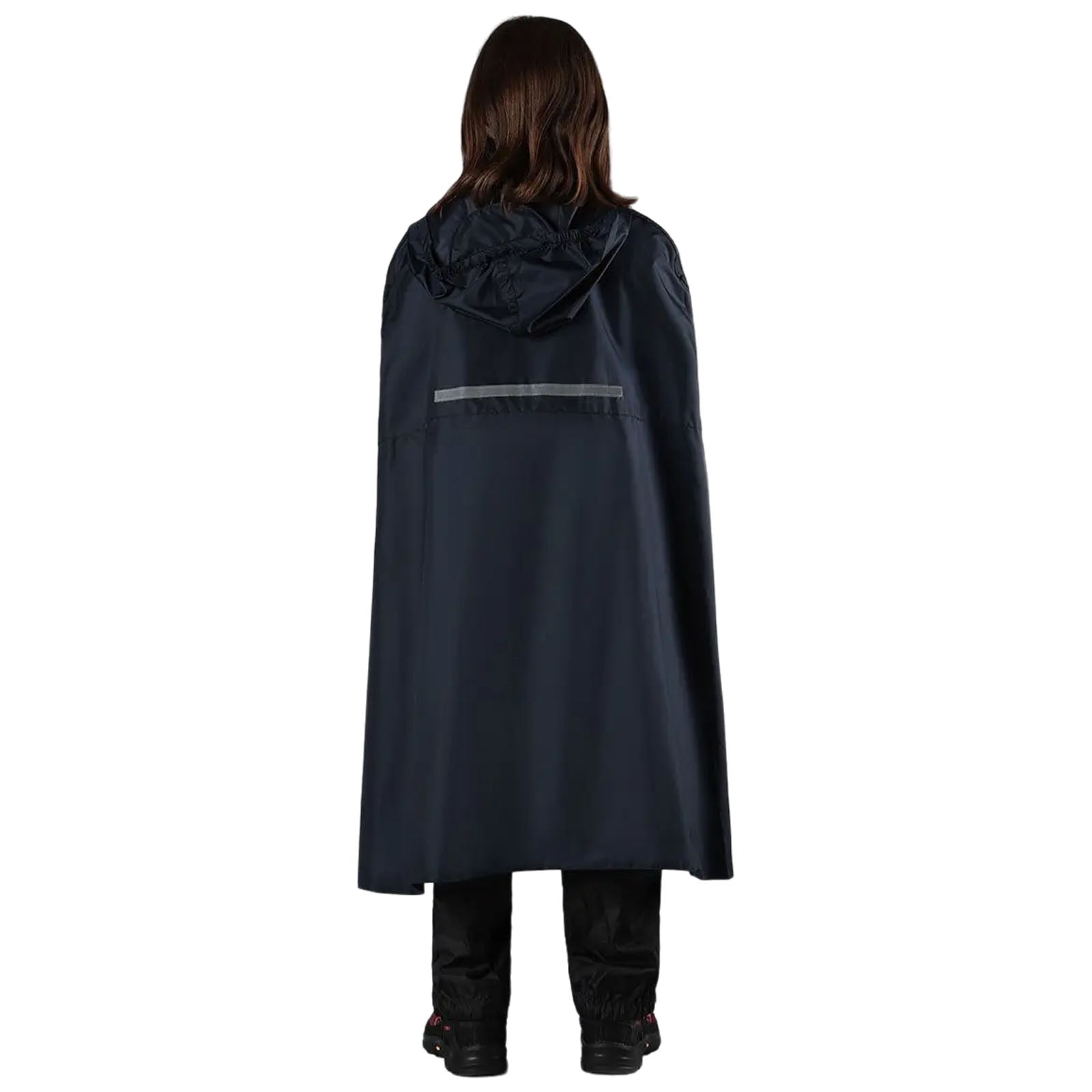 A person wearing a black rain cape stands with their back facing the viewer. The cape has a hood and a reflective strip, while the person wears black pants and shoes.