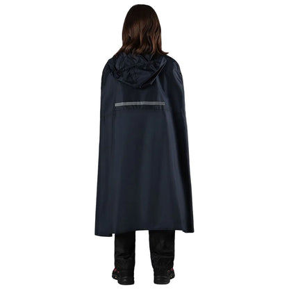 A person wearing a black rain cape stands with their back facing the viewer. The cape has a hood and a reflective strip, while the person wears black pants and shoes.