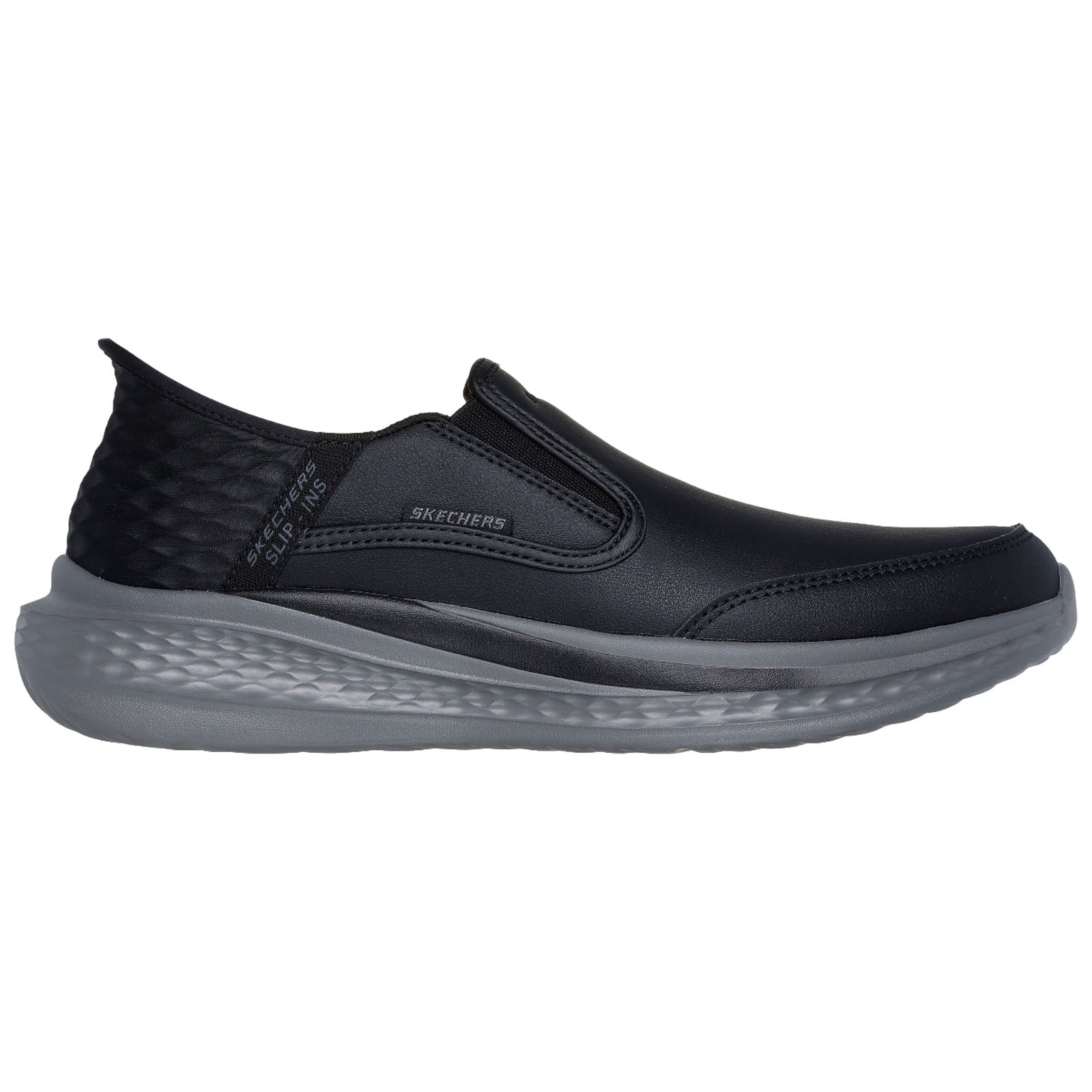 A black slip-on shoe with a smooth surface and elastic side panels is positioned on a plain white background highlighting its sleek design and casual style