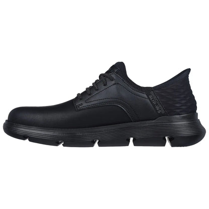 A black athletic shoe is displayed facing left with a smooth leather upper and a textured rear panel featuring a cushioned sole designed for comfort and flexibility in active environments.