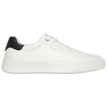 A white sneaker with a black heel cap is viewed from the side. It features a thick sole and is laced up, suggesting it is designed for casual wear.