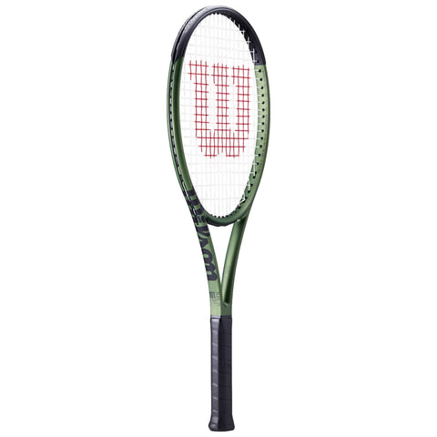 A tennis racket stands upright with a black handle and a green frame The strings form a mesh at the head displaying a red logo on a white background