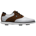A golf shoe with a white body and a brown leopard-print upper sits on a flat surface featuring black laces and a rubber sole with visible spikes for traction.