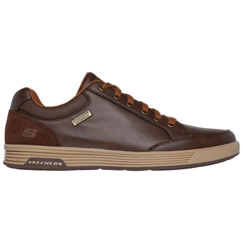 Brown leather sneaker with brown laces sits on a white background showcasing a waterproof tag and brand logo on the side indicating casual footwear suitable for outdoor use