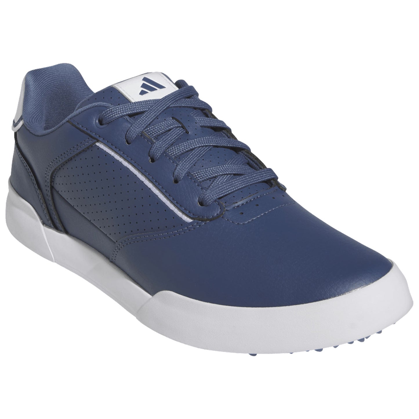 A navy blue sneaker features a smooth leather upper with perforations for breathability and a white sole. The laces are tied, positioned on a neutral background.