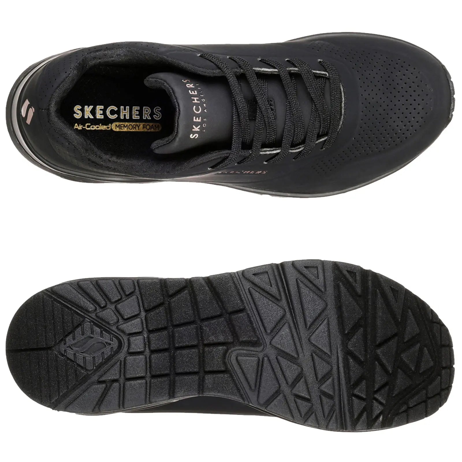 Black sneakers are positioned side by side with one foot slightly raised showcasing their design while a person wearing olive green pants stands in a neutral setting highlighting the footwear.