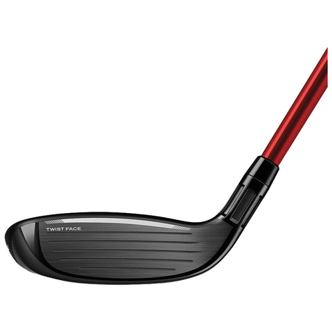 A golf club head with a black and silver face shows grooves for ball striking and features the text "TWIST FACE" on the side with a sleek red shaft extending from it