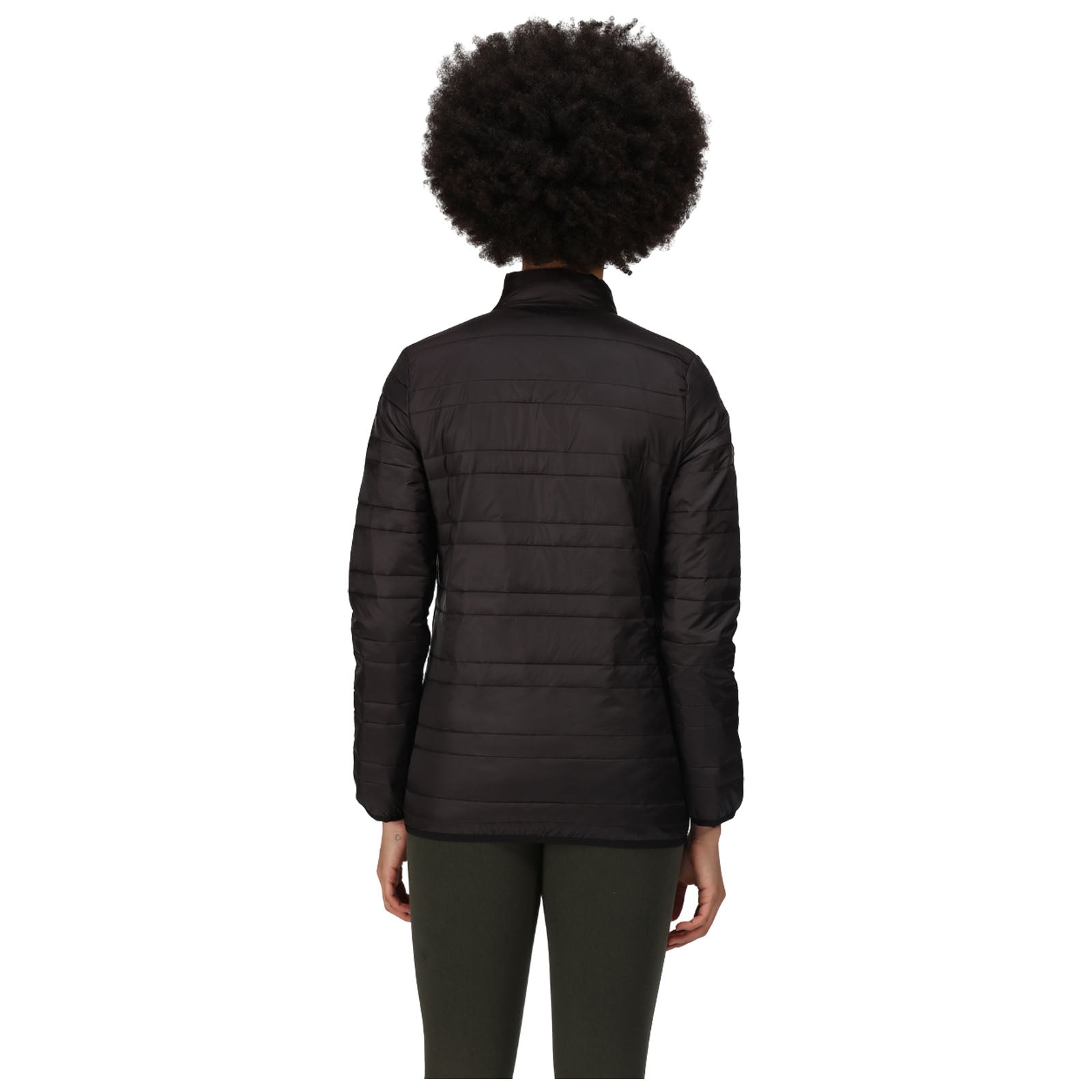 A person is standing with their back to the viewer wearing a black puffer jacket and green pants in a plain white background environment.