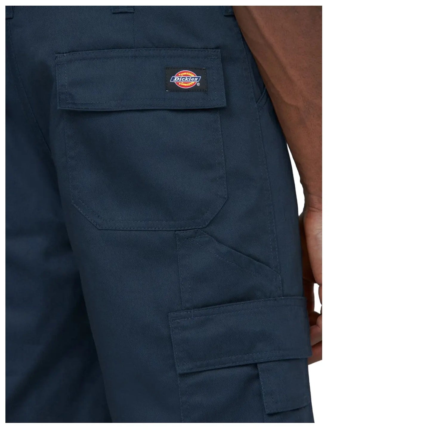 A pair of dark navy pants is displayed showing a close-up view of the side with visible pockets and the Dickies logo stitched on a patch
