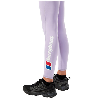 Light purple leggings with a logo on the side are worn with black athletic shoes, suggesting a focus on activewear suitable for exercise or outdoor activities.