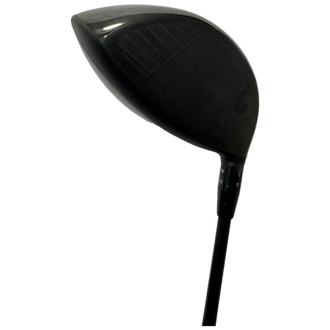 A black golf club driver is positioned upright showcasing its large head and shaft while featuring adjustment settings on the side for customizing performance on the golf course.