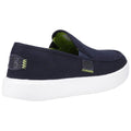 A navy blue slip-on shoe with a white sole rests at an angle showcasing its round toe and elastic panel for easy wear in a neutral background.