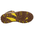 A rugged sole featuring deep treads with yellow accents is positioned flat against a plain background emphasizing its grip and durability suitable for outdoor activities.