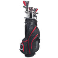 A black golf bag stands upright with several golf clubs partially inserted. It features red accents and multiple pockets, suggesting preparation for a round of golf in an outdoor setting.