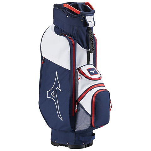 A golf bag stands upright featuring a navy and white design with red accents displaying a brand logo while accommodating golf clubs and accessories for players in a sporting environment.