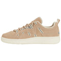 A light brown sneaker sits upright showcasing a suede texture with striped detailing and a white rubber sole surrounded by a plain white background highlighting its design features.