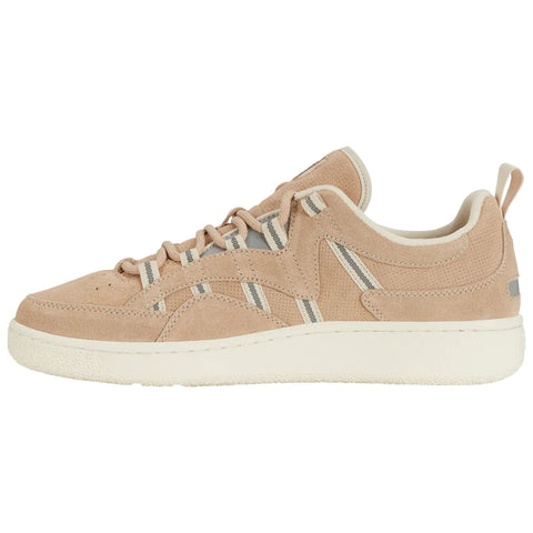 A light brown sneaker sits upright showcasing a suede texture with striped detailing and a white rubber sole surrounded by a plain white background highlighting its design features.