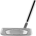 A silver golf putter is positioned upright with a black and silver shaft and textured face for grip; it is isolated on a plain background highlighting its design and craftsmanship.