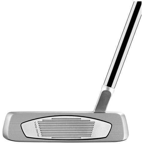 A silver golf putter is positioned upright with a black and silver shaft and textured face for grip; it is isolated on a plain background highlighting its design and craftsmanship.