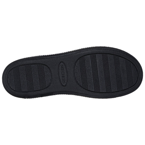 A black shoe sole is displayed facing upward showing a textured pattern designed for traction with the word Skechers embossed in the center surrounded by a smooth outline.