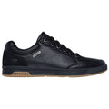 Black leather sneaker with a rounded toe and rubber sole is positioned sideways showcasing its design and features in a plain background suggesting a retail display or online listing