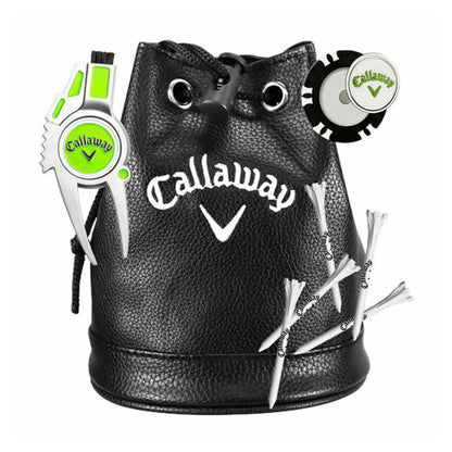 A black leather pouch with a drawstring contains golf accessories including a green and silver divot repair tool a golf tee marker and several white golf tees decorated with a logo.