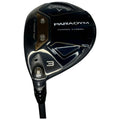 A golf club with a dark blue and black head marked Callaway PARADYM is positioned upright on a white background the clubhead features a sleek design with a visible number 3