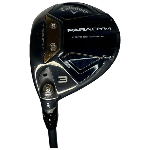A golf club with a dark blue and black head marked Callaway PARADYM is positioned upright on a white background the clubhead features a sleek design with a visible number 3