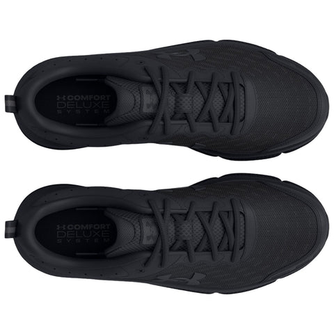 Two black athletic shoes are displayed with their tops facing up laces neatly tied showcasing a textured surface and a logo with the text COMFORT DELUXE SYSTEM visible inside the shoes.