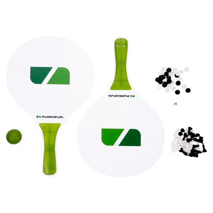 Two paddleball paddles with green accents are positioned alongside a small green ball and assorted small black and white discs, placed on a white background for a clean presentation.