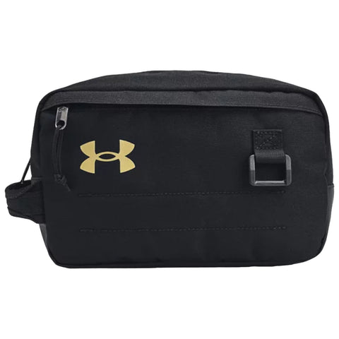 A black toiletry bag features a gold logo on the front with a zipper and a strap for carrying providing a compact storage option for personal items in travel or sports contexts.
