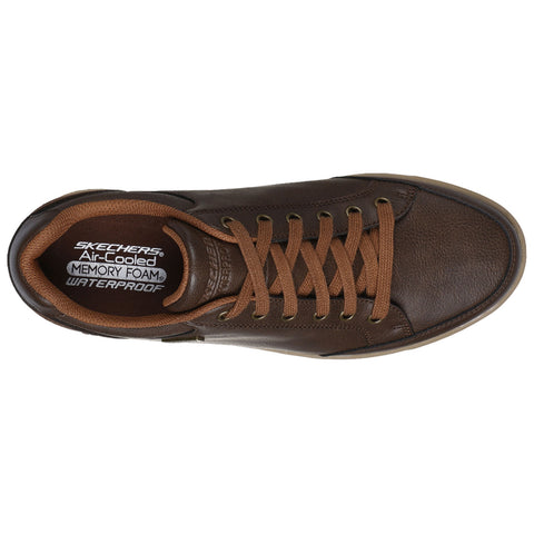 A brown sneaker features an air-cooled insole with memory foam and waterproof material while showcasing brown laces and metal eyelets set against a plain background.