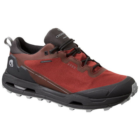 A red and black waterproof hiking shoe is positioned prominently. It features a rugged sole designed for traction on various terrains and is set against a plain white background.