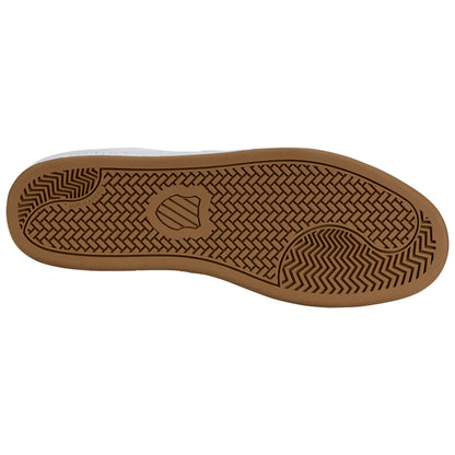 A shoe's sole exhibits a patterned grip design indicating functionality and traction for walking or sports activities placed against a plain white background.