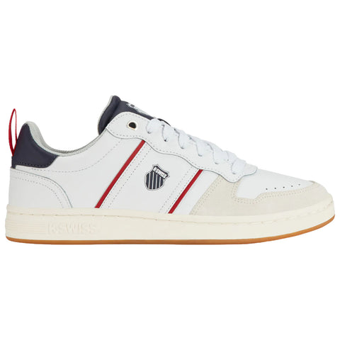 A white sneaker features a smooth leather upper with red and navy stripes an emblem on the side and a gum sole positioned against a neutral background.