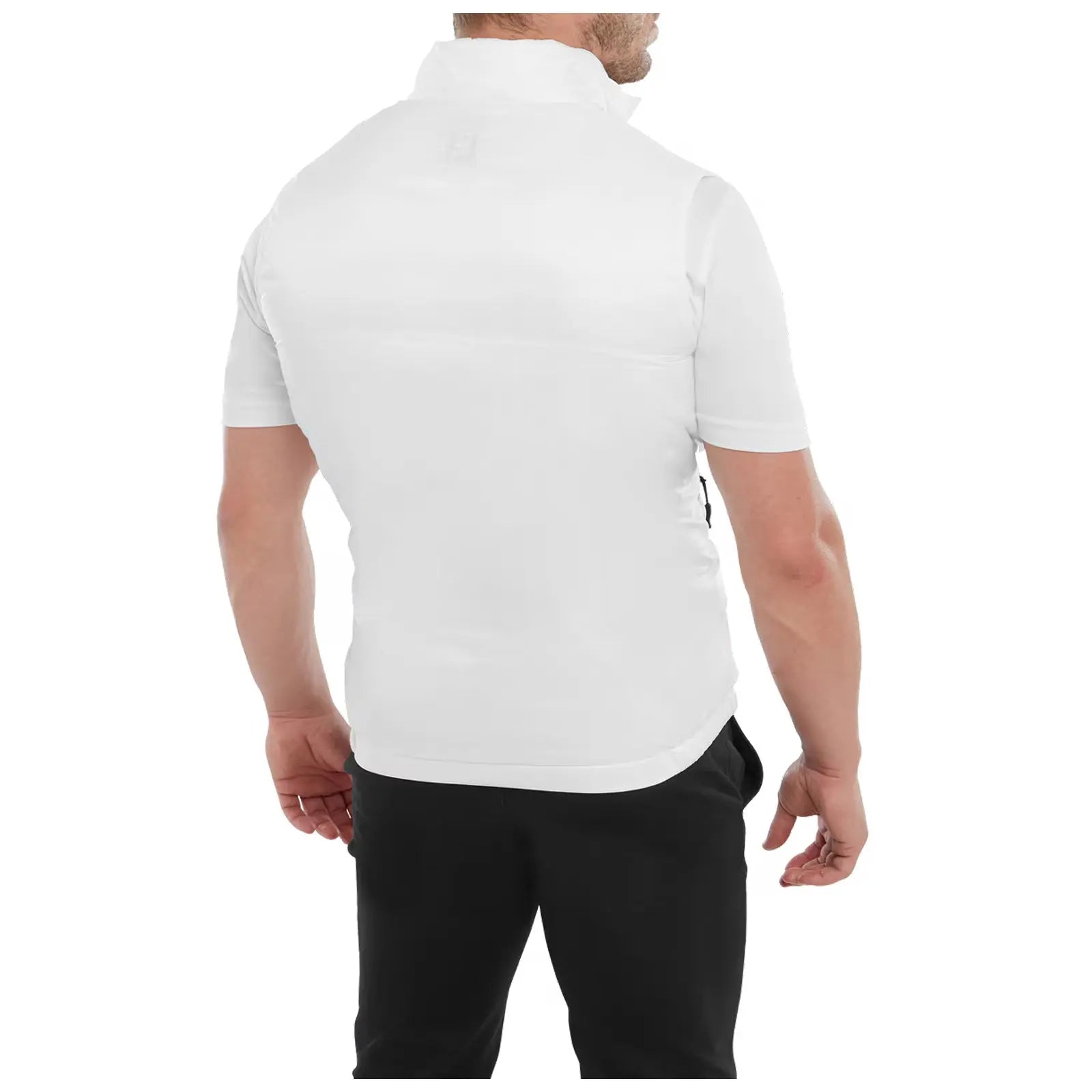 A person stands with their back to the viewer, wearing a short-sleeved white shirt and black pants, showcasing a sleek and modern athletic look in a plain background.
