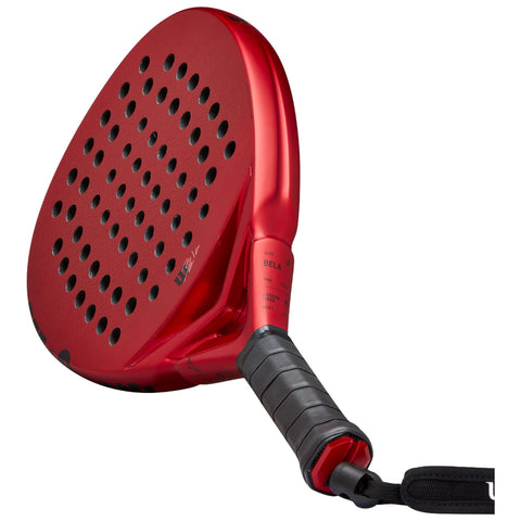 A red paddle with a perforated surface is positioned diagonally with a textured grip at the handle designed for racquet sports showcasing a modern aerodynamic shape and bright color.