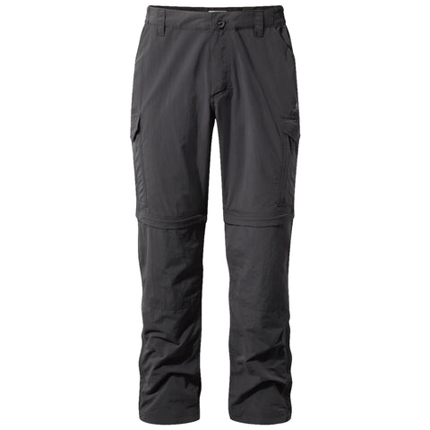 Black outdoor pants with zip-off legs are displayed standing upright featuring multiple pockets designed for versatility and comfort in an outdoor environment suitable for hiking or casual wear.